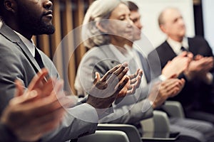 Applauding after presentation of speaker