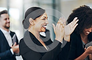 Applause all around. a group of businesspeople applauding during a seminar in the conference room.