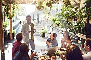 Applause, restaurant and black man with business people in meeting for lunch discussion, planning and success. Cafe