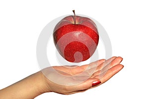 Apple above a hand