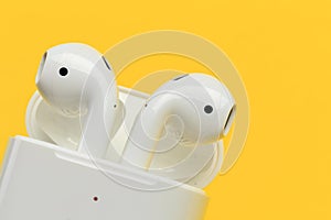 Apple AirPods - wireless bluetooth earphones or headphones and white box for storage and charging, use with Iphone, Ipad or Mac - photo