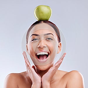 Apple, balance or portrait of excited woman in studio on white background for healthy nutrition or clean diet. Smile