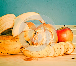 Apple, Bananas, mandarines on table