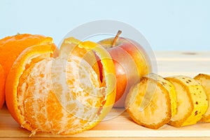 Apple, Bananas, mandarines on table