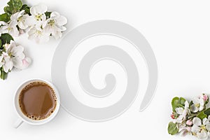 Apple blooming with cup of coffee on white background flat lay copy space