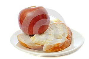 Apple with bread on plate photo