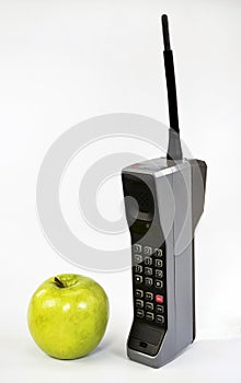 Apple and Brick Cell Phone.