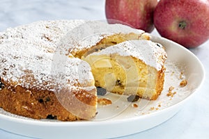 Apple Cake with Sultanas on White Plate Cut