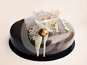 Apple and caramel nutty chocolate cake on white background