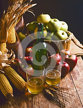 Apple cider bottle and two glasses