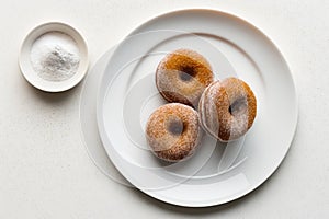 Apple Cider Donuts On Plate, White Background. Generative AI