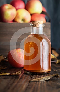 Apple Cider Vinegar with a Box of Fresh Apples