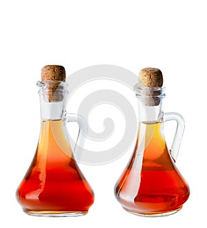 Apple cider vinegar in a special glass bottle. Corkwood. Isolate on a white background.