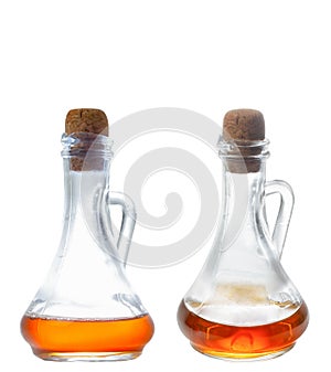 Apple cider vinegar in a special glass bottle. Corkwood. Isolate on a white background.