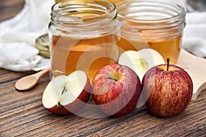 Apple cider vinegar on wooden board, Kombucha tea with apple slices, Healthy probiotic nutrition drink.