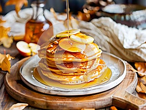 apple cinnamon pancakes drizzled with warm maple syrup