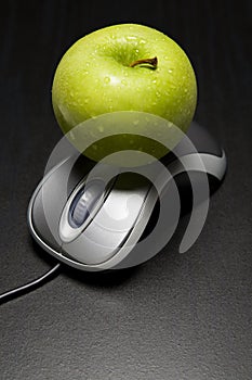 Apple on a computer mouse