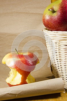 Apple core and a basket with apples