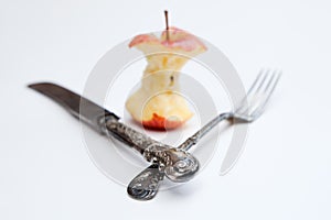 Apple core and cutlery