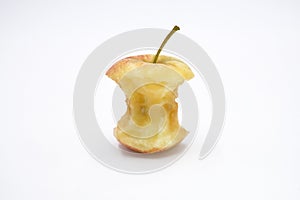 Apple core eaten on white background