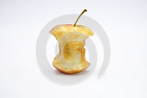 Apple core eaten on white background