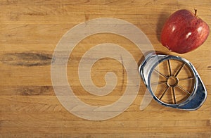 Apple and Corer on a Wooden Countertop