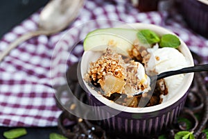 Apple crumble dessert with vanilla ice cream