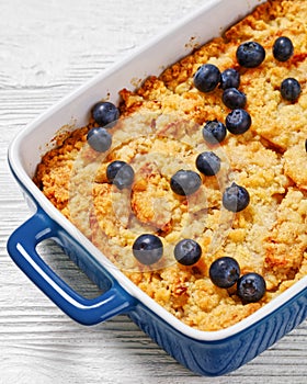 Apple Crumble topped with fresh berries, top view