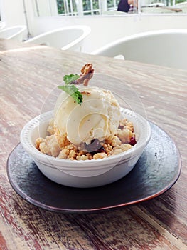 Apple crumble topped with ice-cream