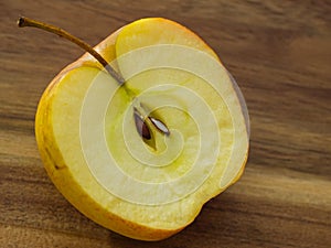 Apple cut in half with stem, core and seeds