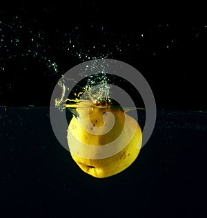 Apple falling through water