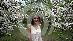 Apple flowers. spring. cloudiness. woman. girl. dress. white dress