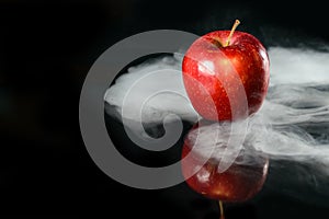 Apple in fragrant smoke