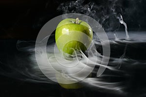 Apple in fragrant smoke