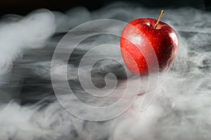 Apple in fragrant smoke