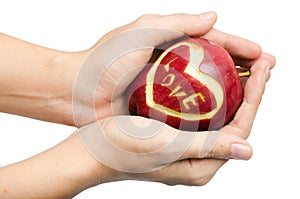 Apple,heart,love in woman hand isolate on white background