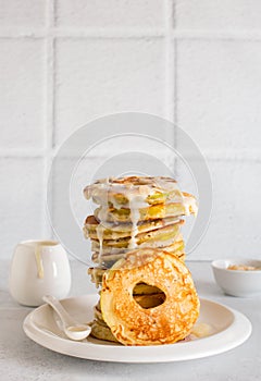 Apple homemade  pancakes on white plate close up