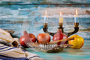 Apple and honey, kosher traditional food of jewish New Year Rosh Hashana talit and shofar