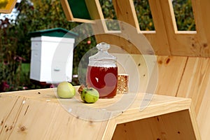 Apple and honey at wood table