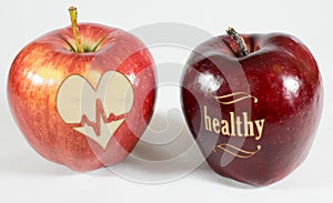 1 apple with the inscription healthy and an apple with a heart