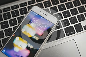 Apple iPhone 6S locked screen with wallpaper