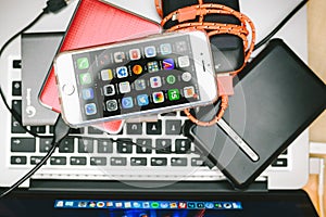 Apple iPhone 6S placed on Macbook Laptop