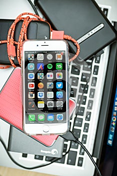 Apple iPhone 6S placed on Macbook Laptop