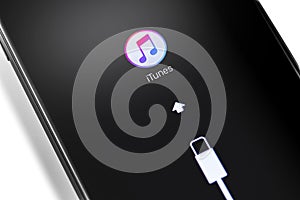 Apple iPhone smartphone with iTunes logo