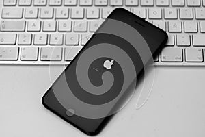 Apple iPhone updated iOs, apple icon and status bar on screen, selective focus