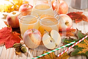 Apple juice, apples and maple leaves