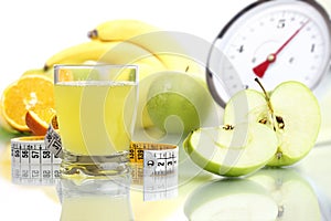 Apple juice in glass, fruit meter scales diet food