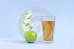 Apple juice levitation. Balance food levitate conceptual creative still life. Balance of fresh green apple slices and a