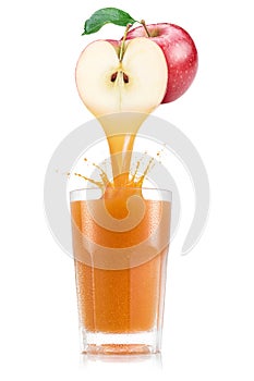 Apple juice pouring out from fruit into glass