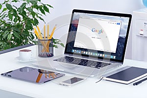 Apple MacBook Pro on desk with Google search web page